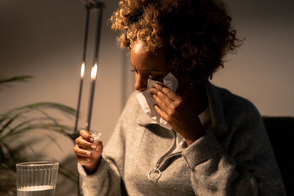 woman sneezing allergy home telehealth care